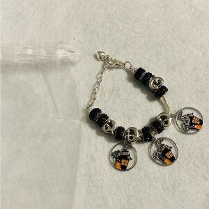 Chic Silver Charm Bracelet with Black and Orange Accents